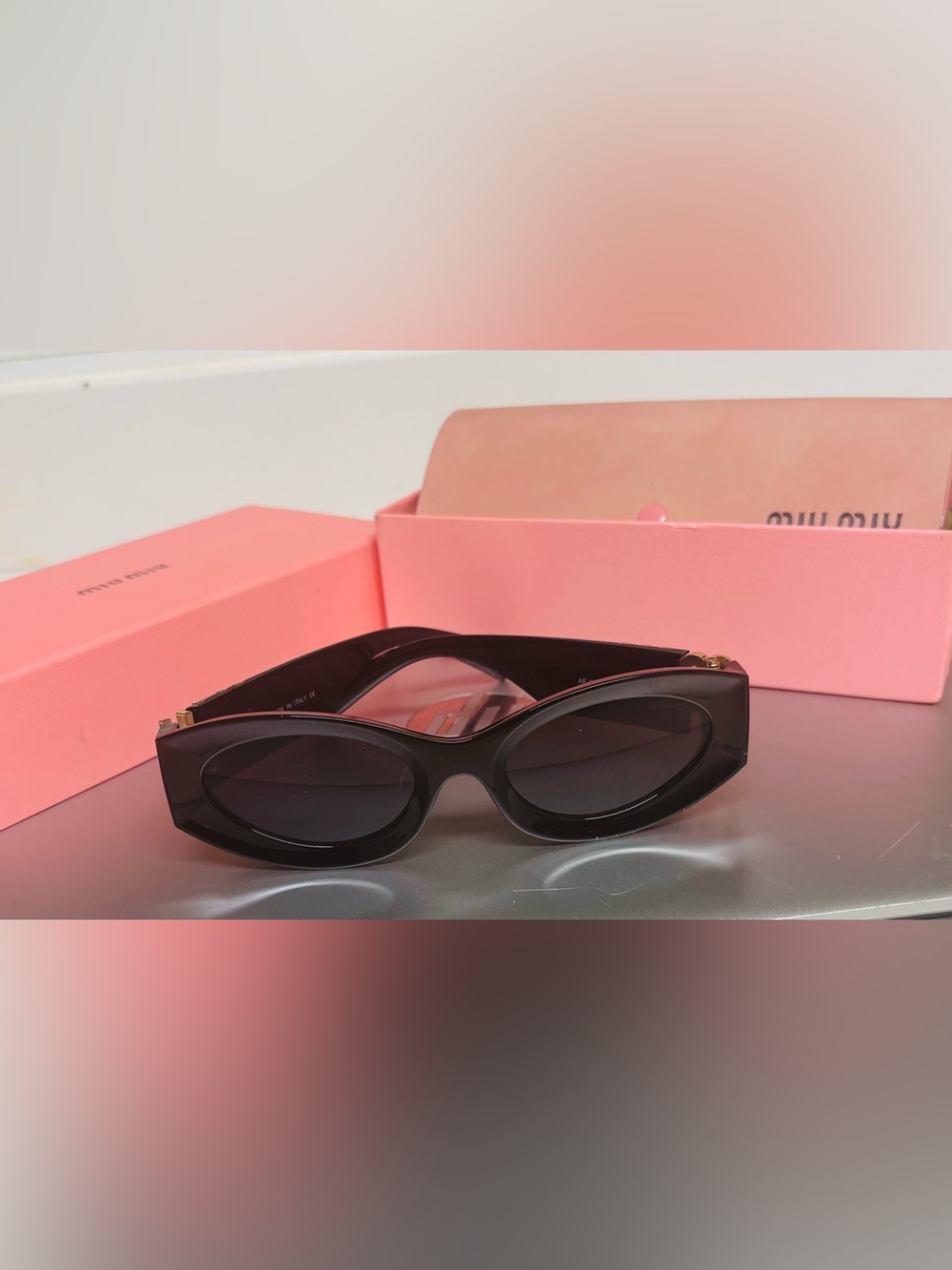 Miu Miu Black Oval Sunglasses with Gold Accent - Picture 3 of 7